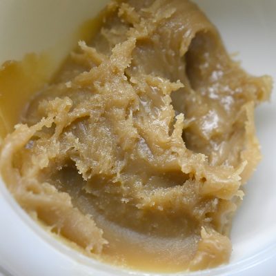 Close-up view of Rosin – Jack Herer cannabis concentrate in a clear container.