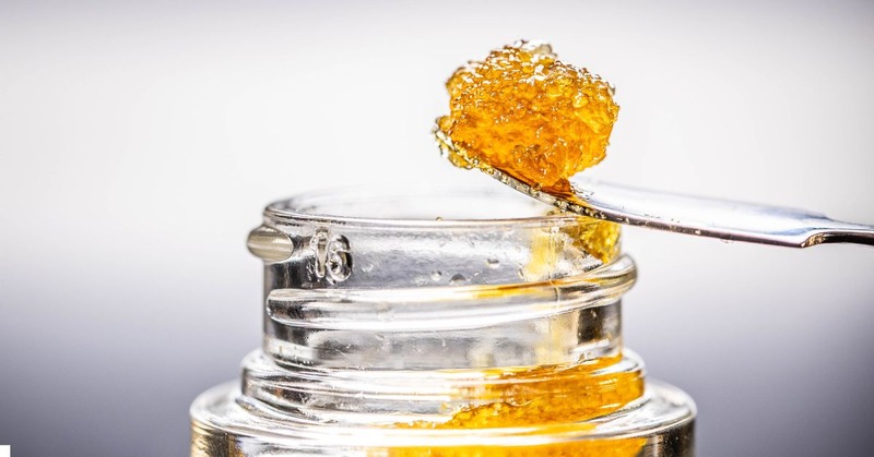 live resin being scooped out of a bottle